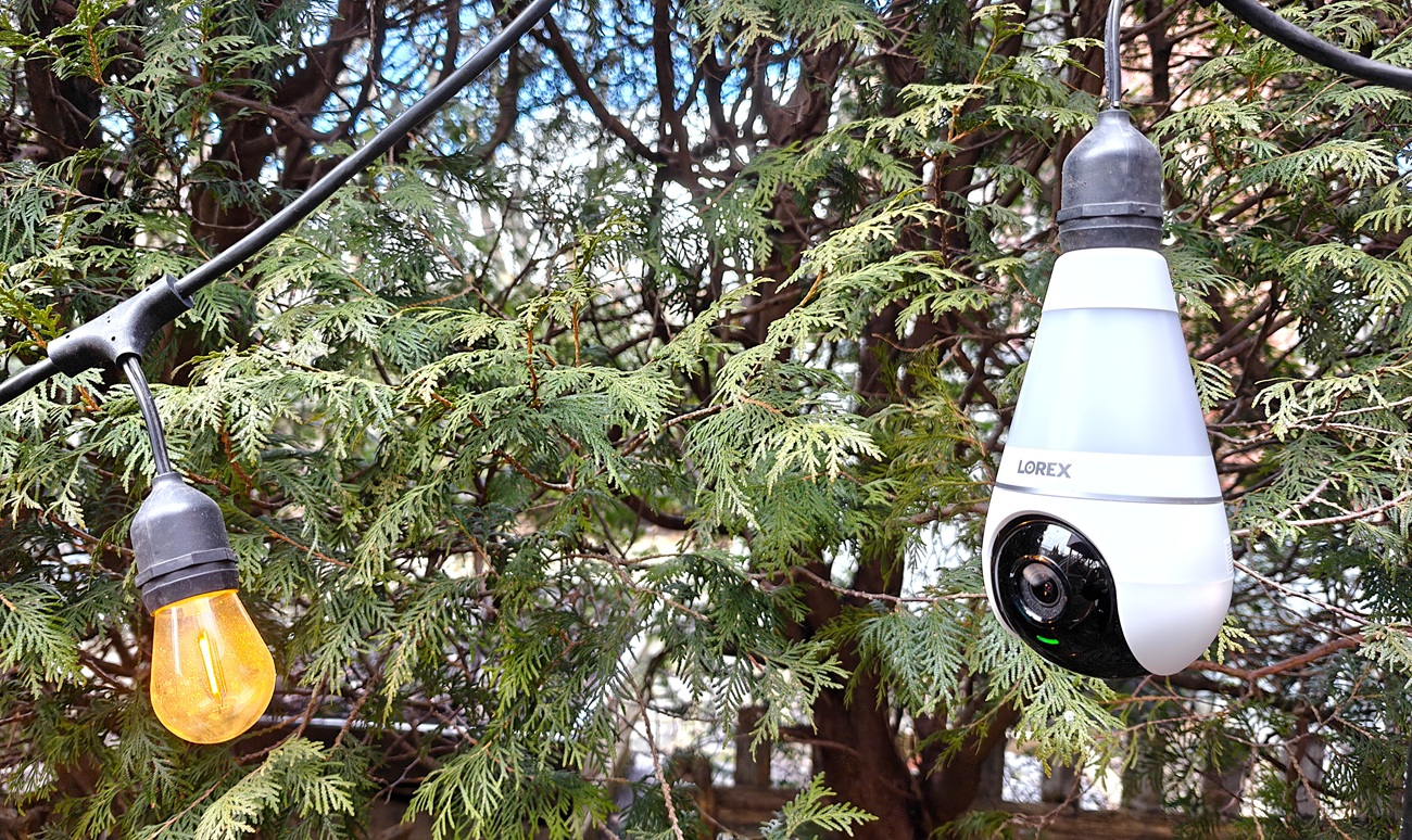 The Lorex camera installed on a string of outdoor lights